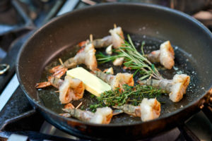 Preparation of king prawns in a non-stick pan Preparation of king prawns in a non-stick pan